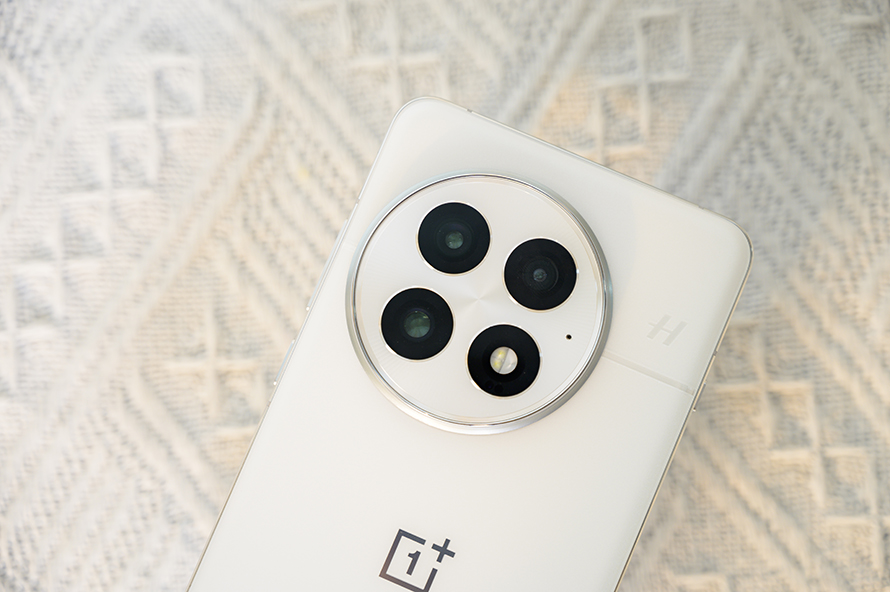 Close-up of the OnePlus 13’s triple-camera module with a smooth frosted finish.