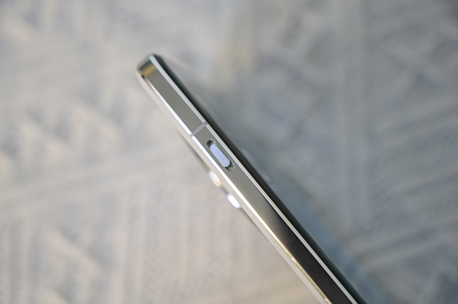 Close-up view of the sleek side profile of the OnePlus 13, showcasing its premium build and buttons.