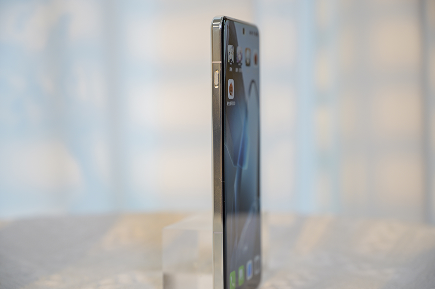 Angled side view of the OnePlus 13 highlighting its metallic frame and elegant design.