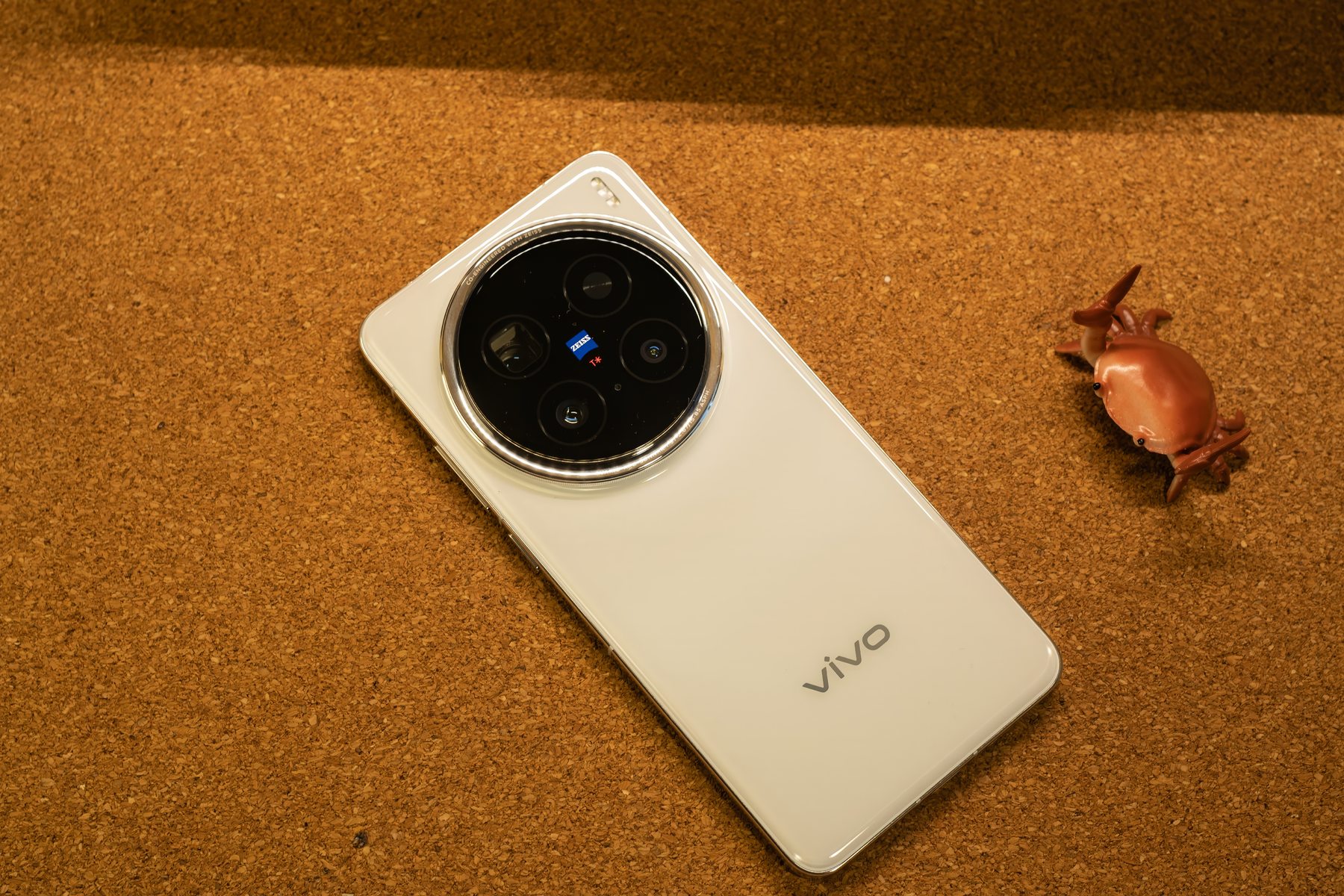 Rear view of the vivo X200 Pro lying flat, showcasing the full white back cover and the bold camera module.