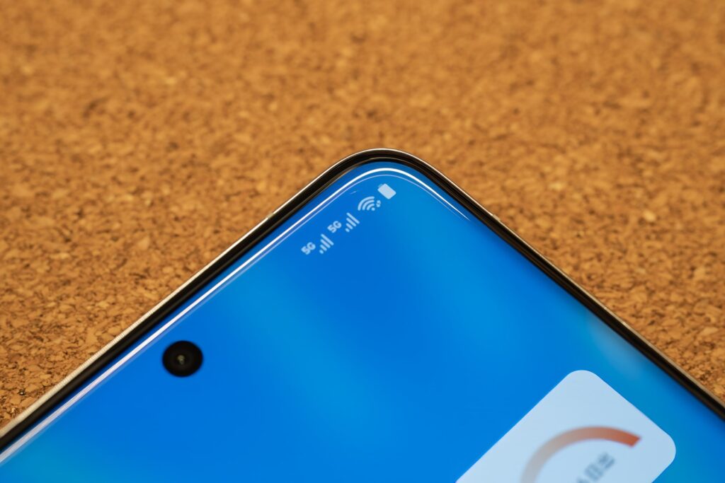 Close-up view of the vivo X200 Pro’s front-facing camera and display, showcasing its sleek blue design.