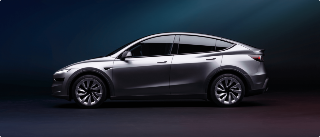 Tesla Model Y facelift side view in a studio setting, highlighting its modern design and futuristic look.