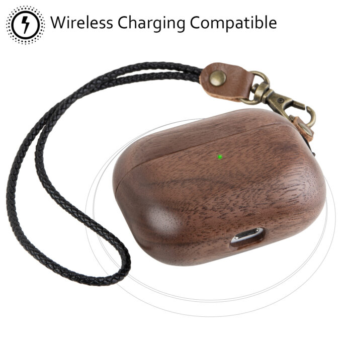 A walnut wood AirPods case placed on a wireless charger, demonstrating its compatibility with wireless charging.