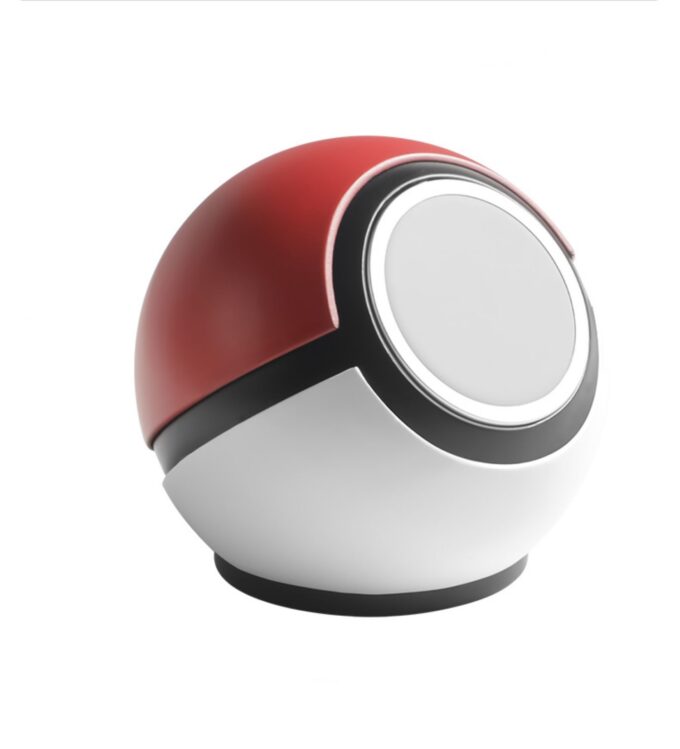 Close-up of the ball-shaped charging dock highlighting its smooth, matte finish in red and white with a black band.