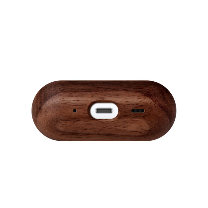 The underside of the walnut wood AirPods case, showing the precise cutout for seamless charging.