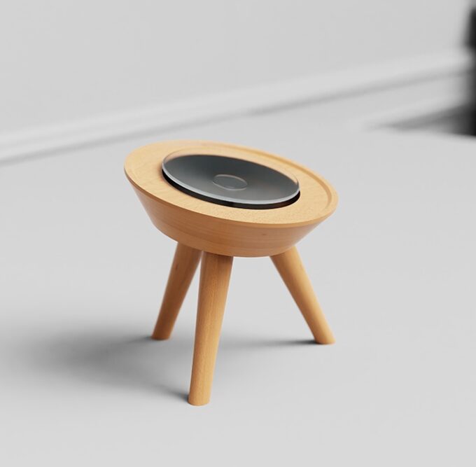 A light beech wood stand holding a Mac Mini, highlighting its minimalist and natural aesthetic.