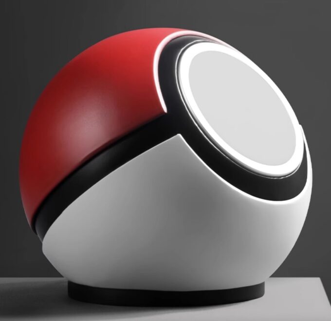 An iPhone propped against the spherical dock at a slight tilt, demonstrating its stable charging position.