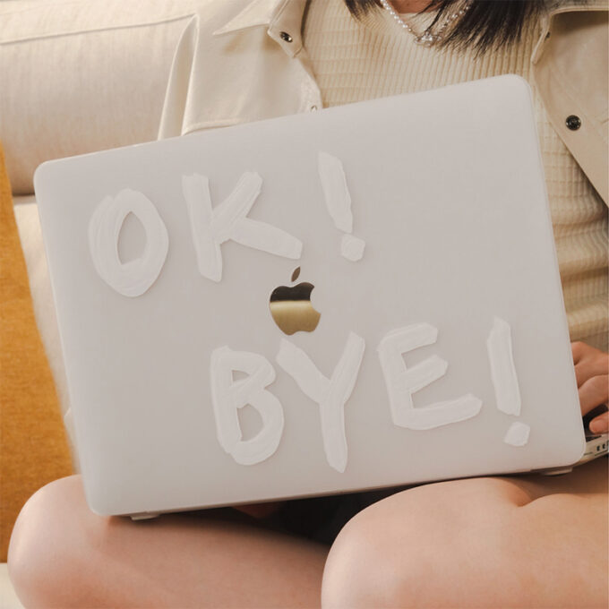 A user showcasing the MacBook case with a playful “OK! BYE!” design, emphasizing its semi-transparent finish.