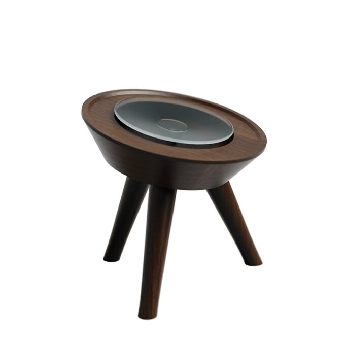 A walnut wood Mac Mini stand with suction cup feet for added grip, displayed on a clean surface.