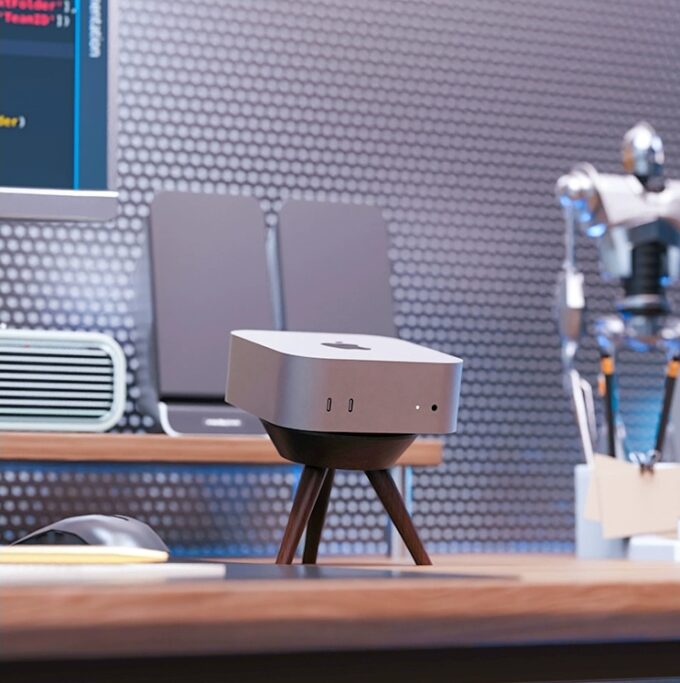 A walnut wood Mac Mini stand on a desk, showcasing its elevated design and natural wood finish in a modern workspace.