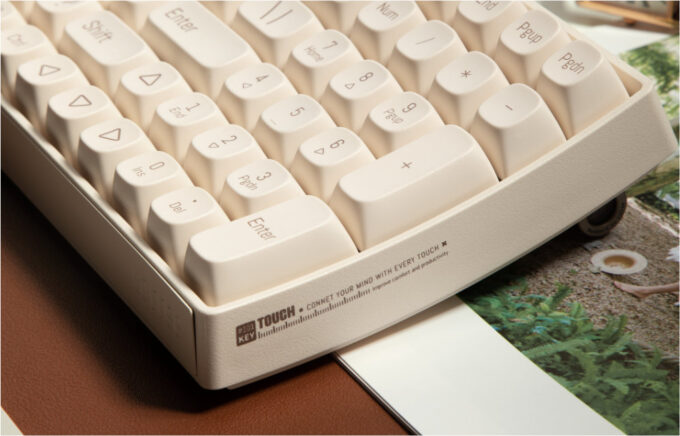 A side perspective highlighting the ergonomic 11.5° curved design for comfortable typing.