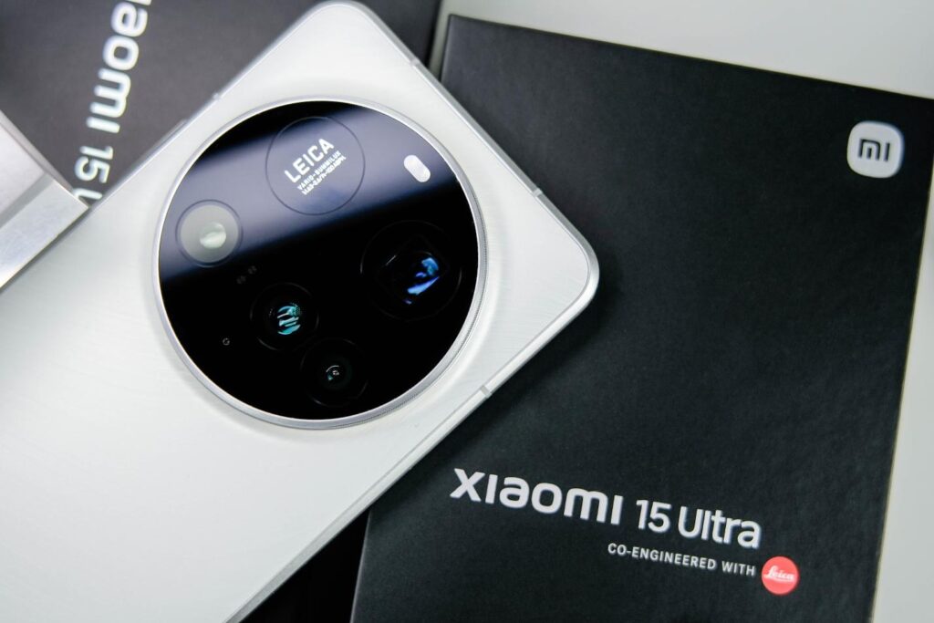 Xiaomi 15 Ultra placed on its box, focusing on the Leica-branded camera system and premium packaging.