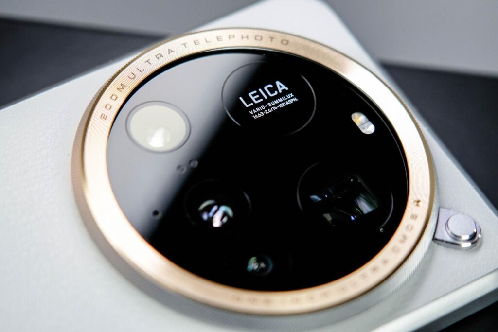 Close-up of Xiaomi 15 Ultra’s circular camera module with Leica branding and gold accents.