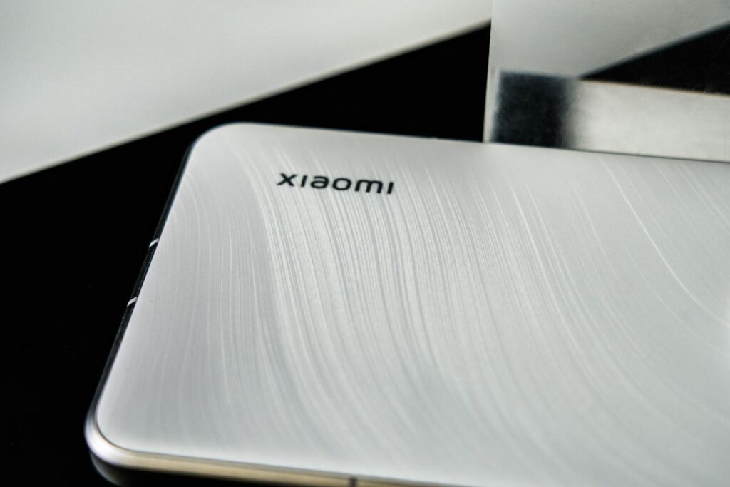 Brushed metal back of the Xiaomi 15 Ultra, featuring the Xiaomi logo and a premium texture.